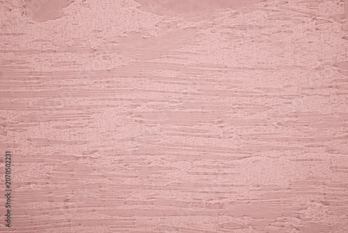 Pink textured plaster wall surface background