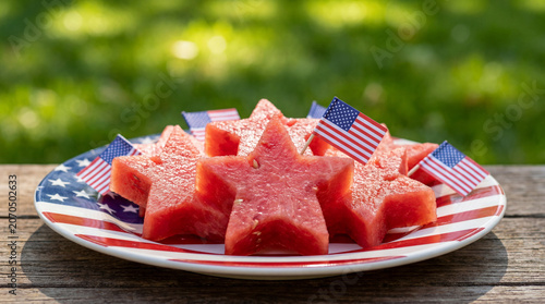 Independence Day star shaped watermelon slices on red white blue plate with flag decorations for patriotic summer food celebration product promotion design