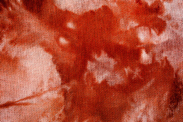 Close up of red tie dye fabric texture