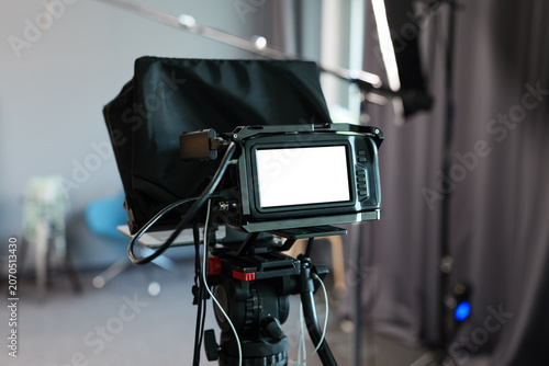фотографія Video camera with white display in studio