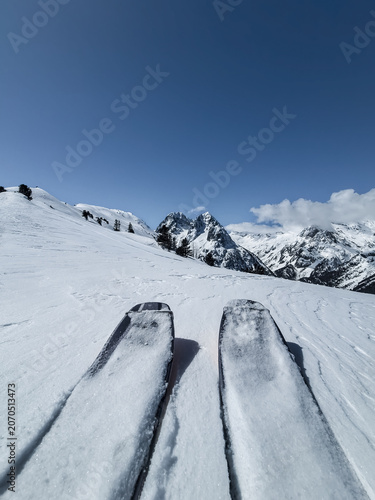 Single ski tourer looking at Aiguilles Rouges mountain range