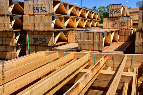 Stacks of premanufactured wood construction materials ready use at construction site.