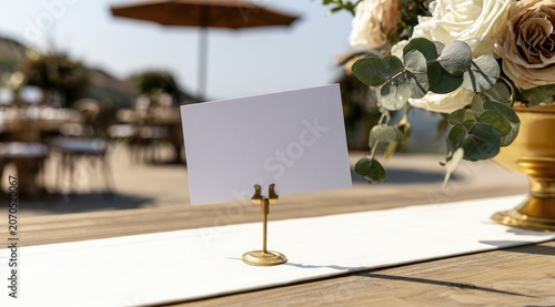 Empty place card awaits personalization at an outdoor table setting