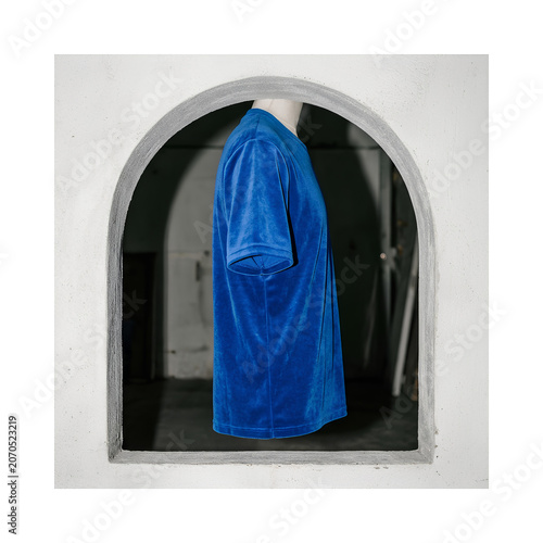 Blue Cloaked Figure in Arch Alcove.