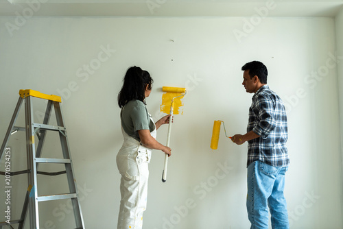 Photography Couple painting room together photo