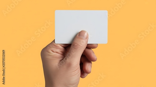 Blank business card, hand holding card, white card, orange background, empty card