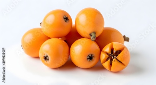 Group of fresh loquat fruits on white studio background with isolated