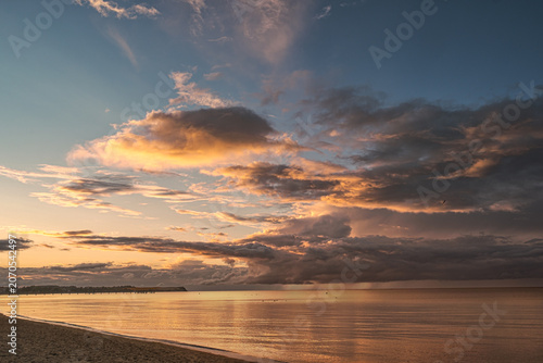 Evening atmosphere during a picturesque sunset at the beach in Boltenhagen on the Baltic Sea.