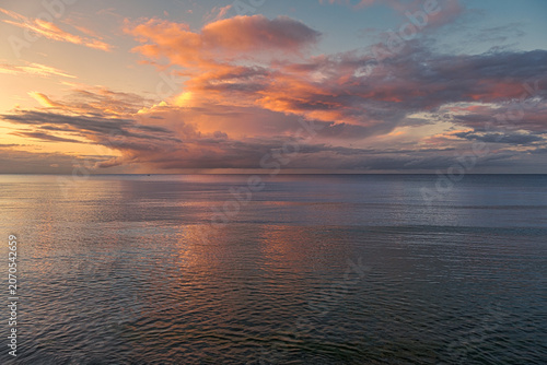 Evening atmosphere during a picturesque sunset at the beach in Boltenhagen on the Baltic Sea.