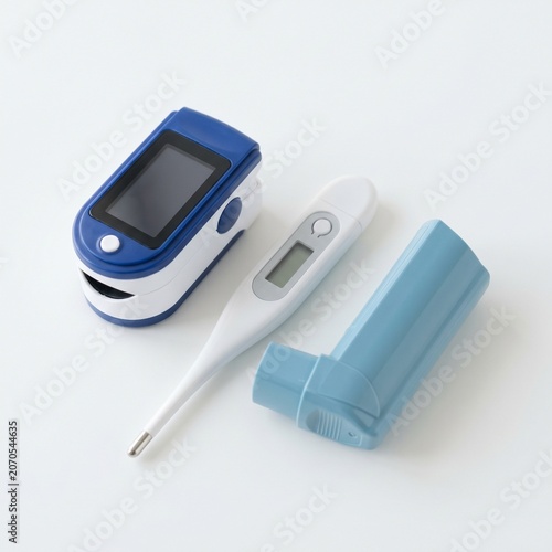 Digital blood pressure and blood glucose monitoring devices displayed together for health tracking