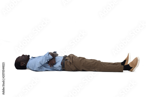 Young man lying on the ground look up on white background