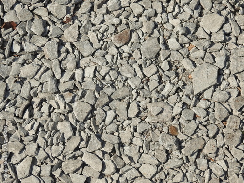 Cuadro en lienzo Close up of crushed stone featuring rough gravel texture, irregular rock fragments, and natural mineral tones