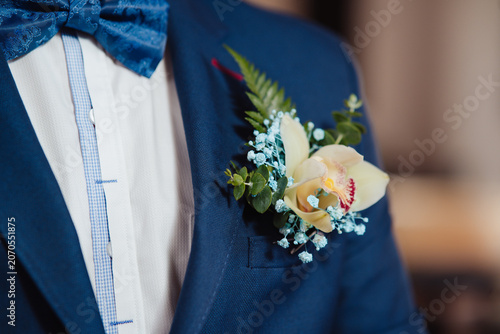 Slika na platnu man in a suit with a flower on his wedding suit