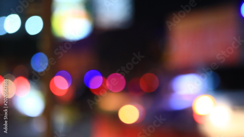 Fotografía Colorful abstract city bokeh lights at night with blurred street traffic and vib
