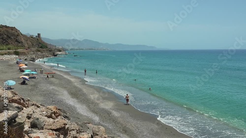 Waves rolling onto the beach, Playa de Calaceite, near Torrox Costa, Andalusia, Spain