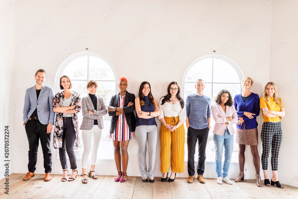 Fototapeta premium Diverse group of men and women standing together indoors
