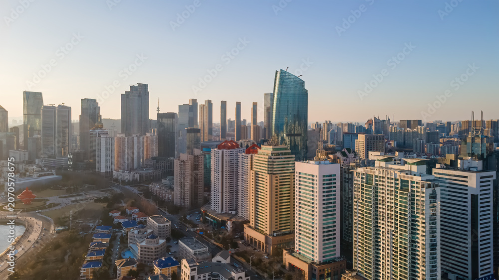 Obraz premium Modern Urban Skyline With Dense High-rise Buildings At Dawn
