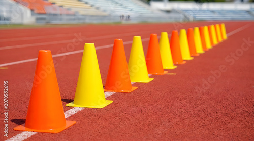 Yellow and Orange Traffic Cones on Athletic Track.