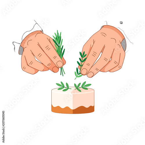A pair of hands carefully garnishes a small round cake with fresh green herbs