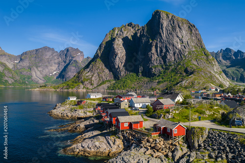 Bild auf Leinwand Aerial scene of Lofoten, Norway, with red rorbuer on rocky shores, deep fjord, w