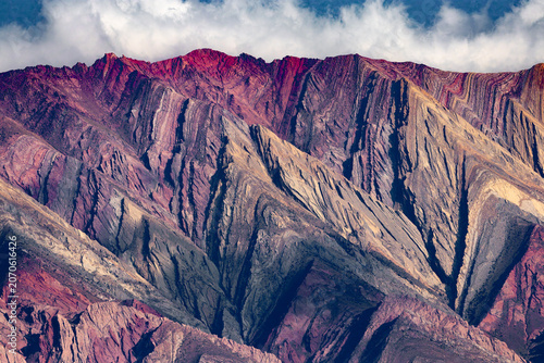Cuadro en lienzo A dramatic view of vividly colored, folded Andean mountains, revealing exquisite rock layers and dramatic stratification