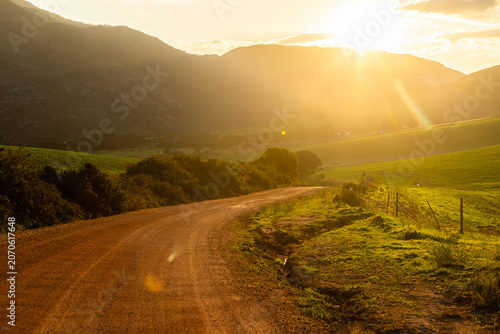 sunrise light on rural dirt road, Stanford, South Africa