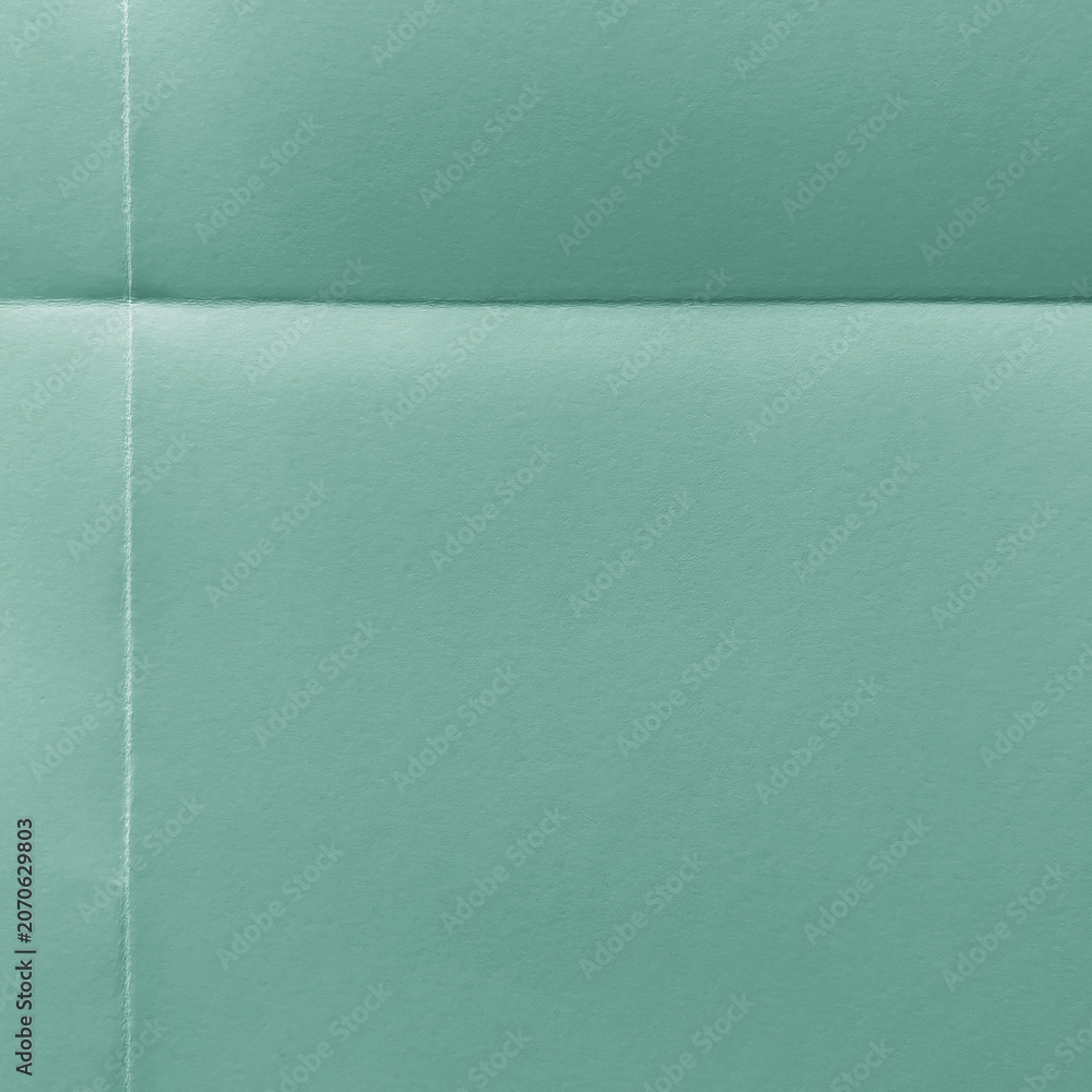 Fototapeta premium Textured teal paper background with copy space