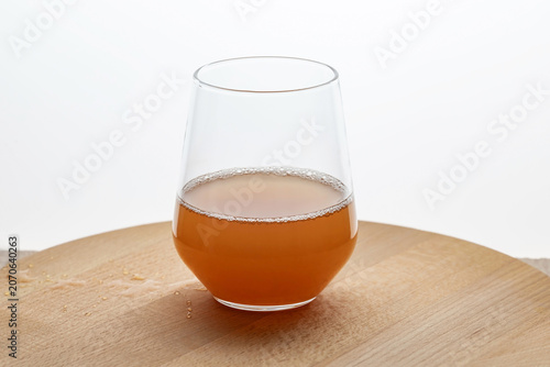 glass of fresh pear juice on a wooden table