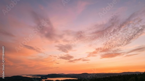 Breathtaking sunset over a calm lake with purple and orange clouds