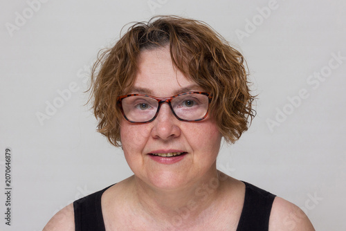 Front view portrait of mature woman with glasses for reference dataset.