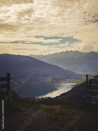 Beautiful view of the lake from Zell am See - Salzburg in Austria, with a cloudy sky and sunshine