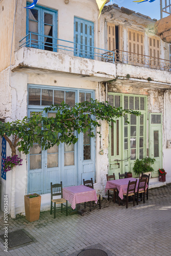 Tables of a restaurant in the streets of Tzermiadon on the Lasithi high plateau on the island Crete, Greece.