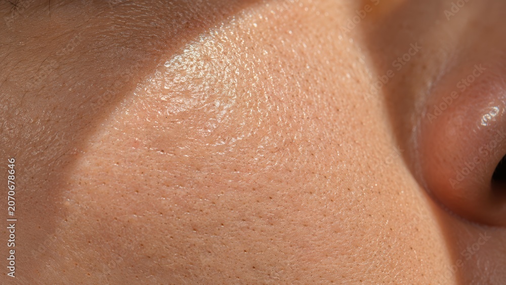Fototapeta premium Close-up of healthy skin texture showing natural pores and smooth facial surface detail
