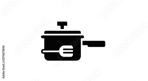 Photography Black pot with fork and lid.
