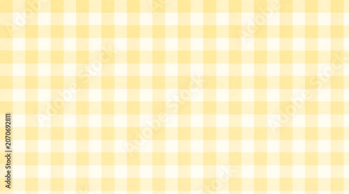 Yellow gingham pattern background with a classic checkered picnic cloth design
