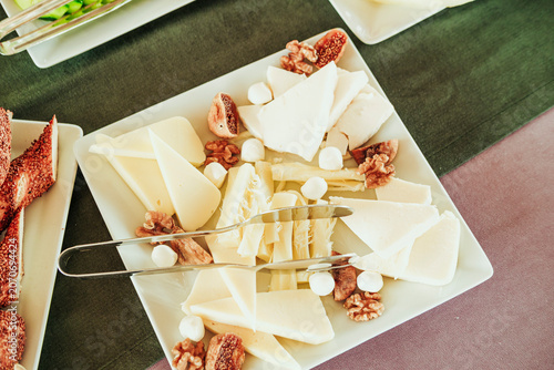 traditional turkish breakfast feast with rich variety on table photos series, cheese plate with fig and wallnuts