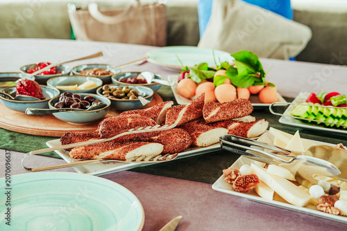 traditional turkish breakfast feast with rich variety on table served on boat gulette for holiday tourists