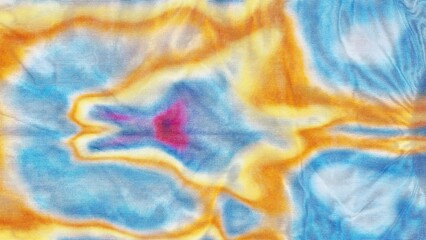 tie dye fabric background creates vibrant psychedelic pattern on organic textured cotton material in macro top view