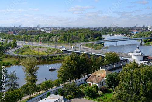 Aerial iew of the Kotorosl River, parks, buildings and pipes of factories in Yaroslavl, Russia, decorated with flags with the coat of arms of the city