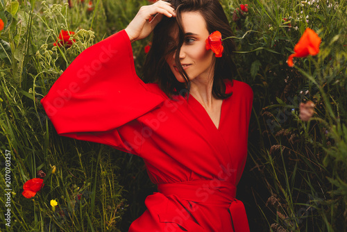 Tablou pe pânză Playful brunette woman with a coquettish look and gentle smile posing genuinely