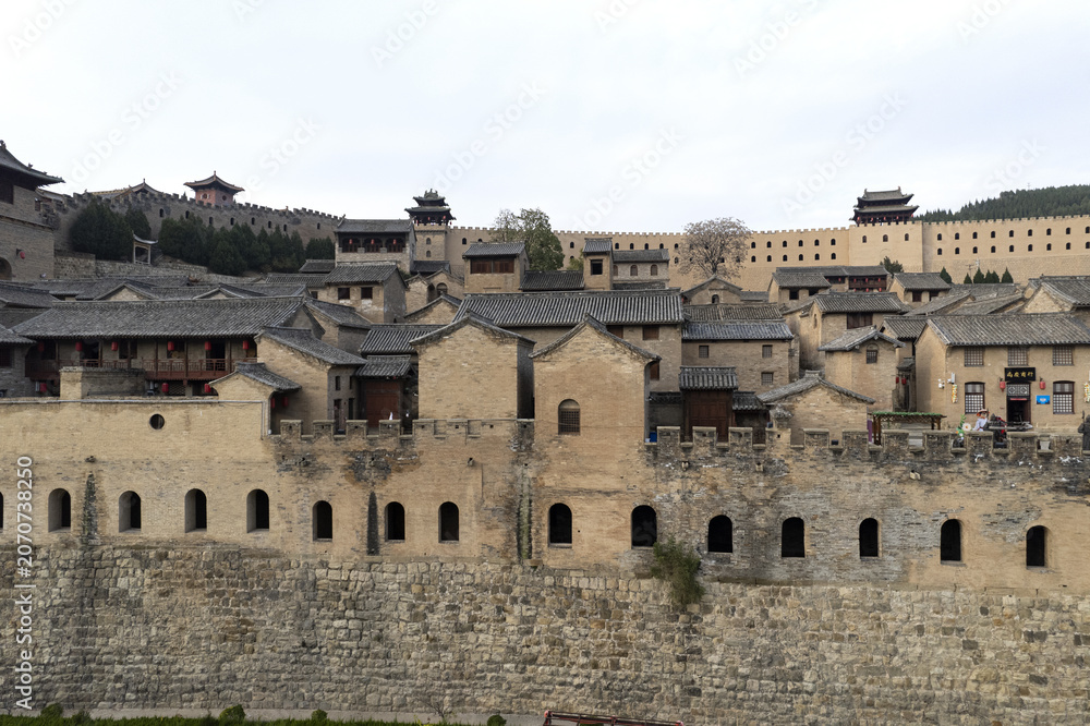 Obraz premium Ancient Chinese Fortified Village with Stone City Walls