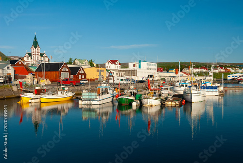Εκτύπωση καμβά Fishing boats in Húsavík Harbor Iceland with the iconic Húsavík Church colorful