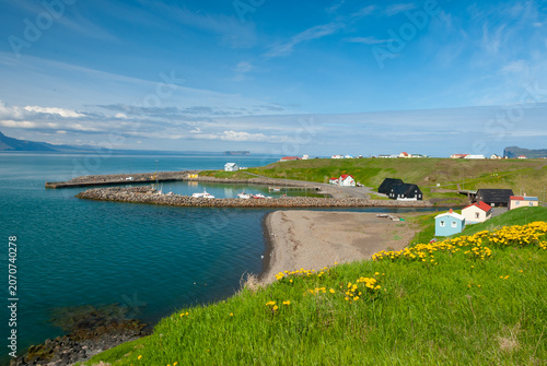 The Icelandic Emigration Center in Hofsós Iceland with traditional black timber houses overlooking Skagafjörður and scenic coastal surroundings