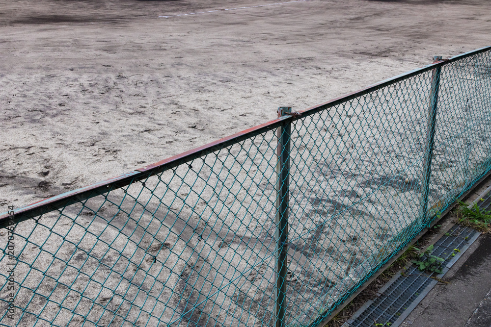 Fototapeta premium Chain link fence surrounding baseball field