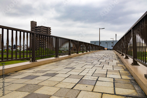 Pedestrian bridge walkway with perspective lines