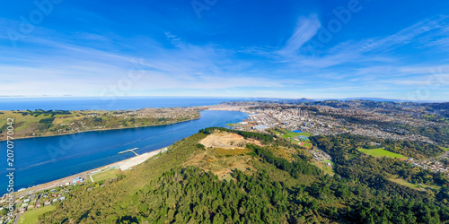 Aerial view of a coastal city under the blue sky, Dunedin, New Zealand