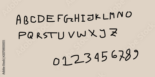Handwritten alphabet and numbers on beige background