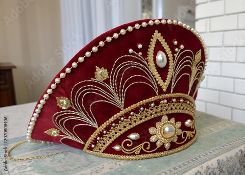 Traditional russian kokoshnik headdress made of red velvet and gold embroidery with headdress kokoshnik traditional folklore embroidery ceremonial headwear ornament heritage accessory
