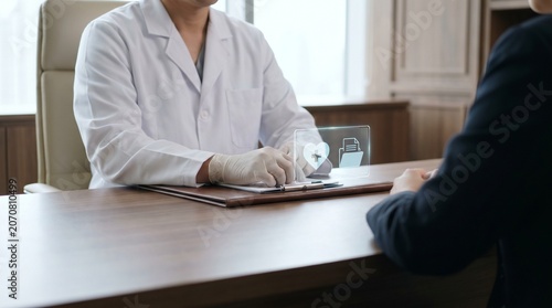 Medical professional discussing digital health records with patient during consultation in modern clinic office