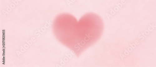 Soft pink heart shape with subtle texture on a light pink background